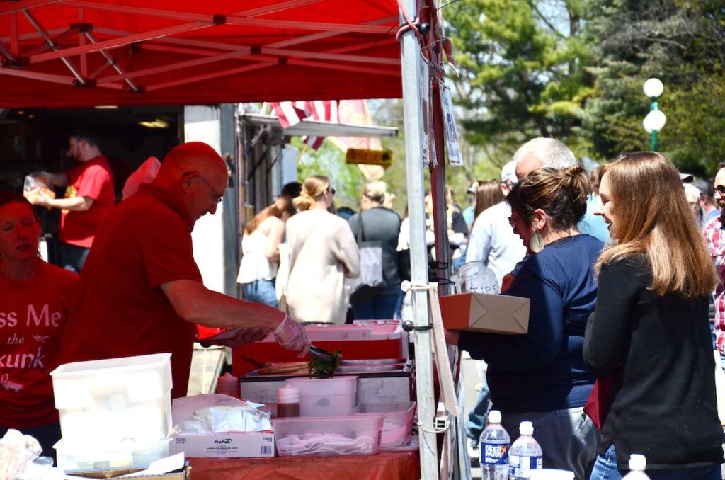 Food vendor making food and serving guests at the Lewisburg Arts Festival