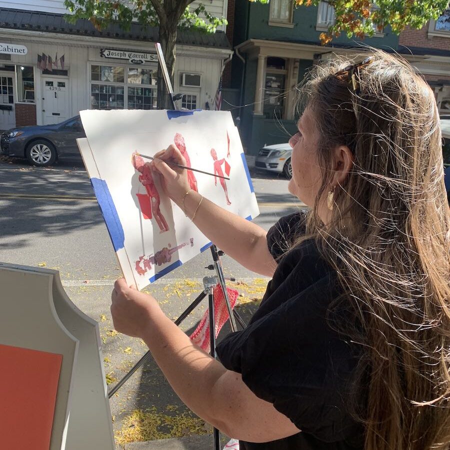 Artist demonstrating her art during the Stroll Through the Arts