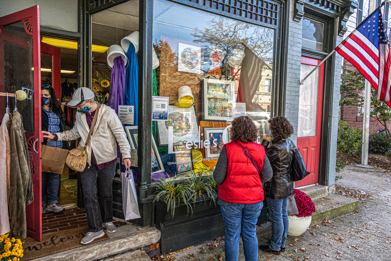 Patrons looking into store window while strolling through the arts downtown Lewisburg, PA